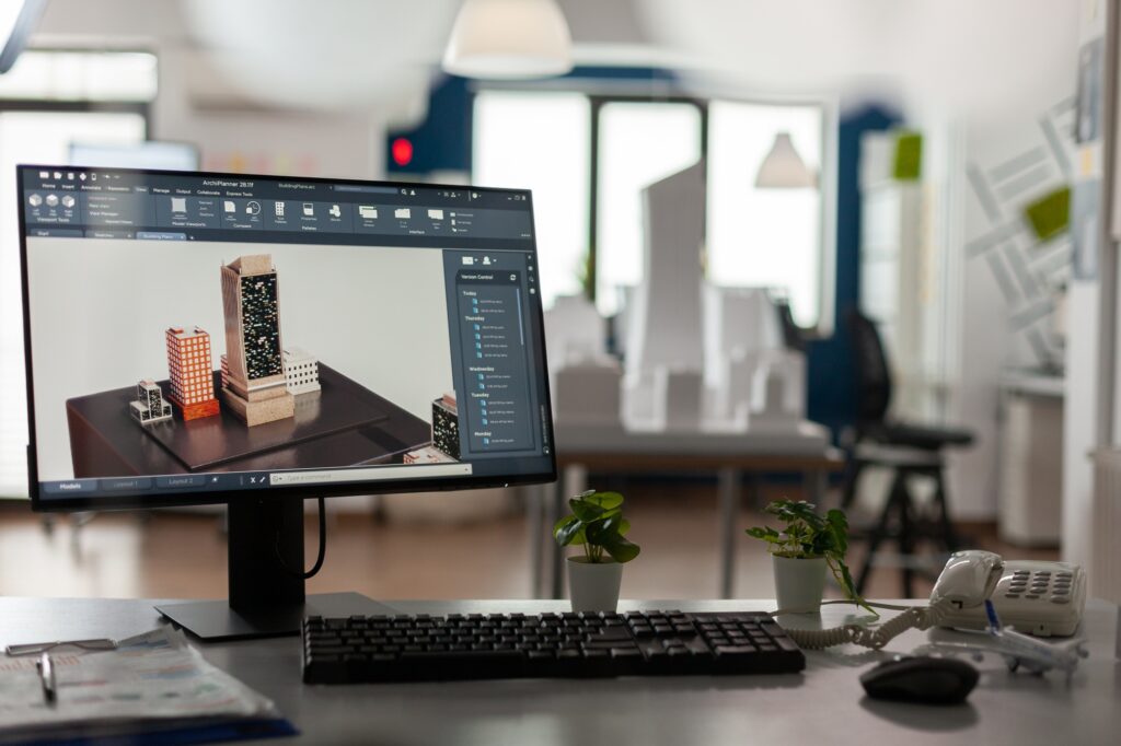 Computer display with 3d render software of architectural building complex